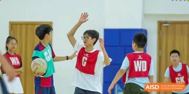 Student enthusiastically posing during a dance or physical education class at Wycombe Abbey School Hangzhou.
