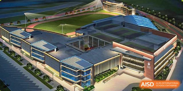 An aerial view of the modern Xi'an Liangjiatan International School campus, showing the running track, sports field, and nearby building structures.
