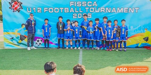 The Xiamen International School football team posing with their medals after the FISSCA Football Tour 2015.