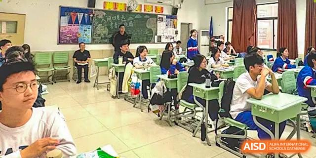 A Yali High School International Department classroom with students seated at desks, viewed from the side.