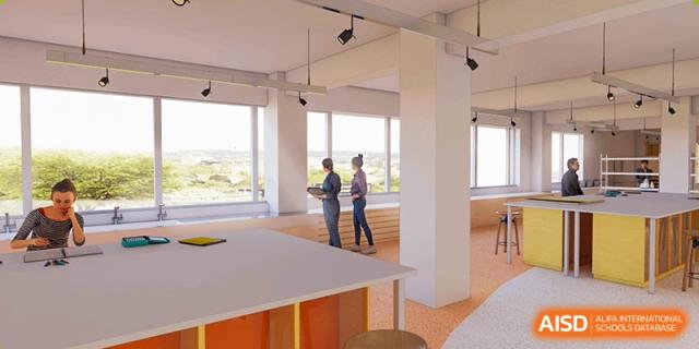 Students from Yew Wah International Education School of Zhejiang Tongxiang standing in a bright, modern classroom or studio space.