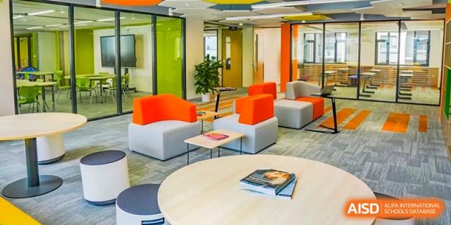 A bright and contemporary common area or lounge inside Yew Wah International Education School of Yantai Campus.