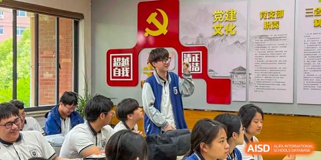 A student from Wenzhou No.22 Senior Middle School giving a presentation or addressing classmates in a classroom.