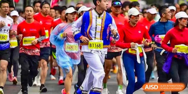 Runners from Wenzhou No.22 Senior Middle School, including one in a traditional, brightly colored costume, participating in a marathon or long-distance race.
