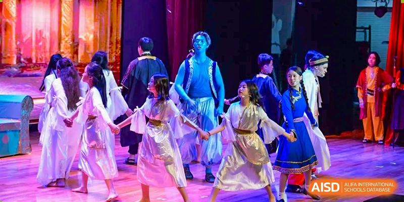 Students from Dulwich International High School Programme Hengqin (DHHQ) participating in a dramatic or theatrical performance in traditional-style costumes.