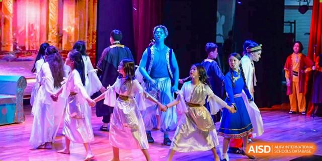 Students from Dulwich International High School Programme Hengqin (DHHQ) participating in a dramatic or theatrical performance in traditional-style costumes.