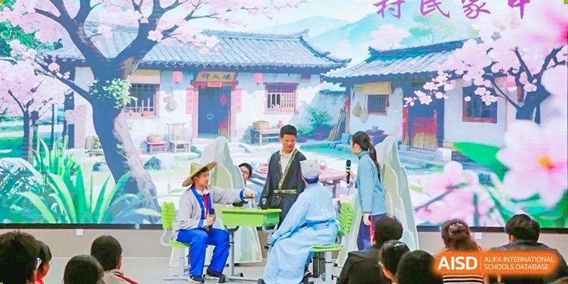 Students in traditional attire performing a scene in a setting resembling an old Chinese courtyard at Shanghai Nanyang Model Private School.