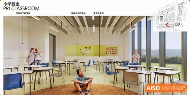 A brightly lit, modern QSI International School of Shenzhen classroom with tables and chairs, showing a unique design aesthetic.