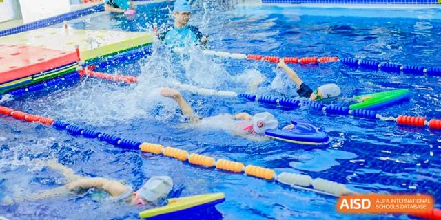 An underwater view of a student swimming laps in a competitive style during a training session or class at Suzhou Foreign Language School.