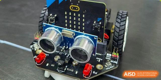 A close-up view of a robotics project featuring sensors and a micro-bit controller at Korea International School in Shenzhen.