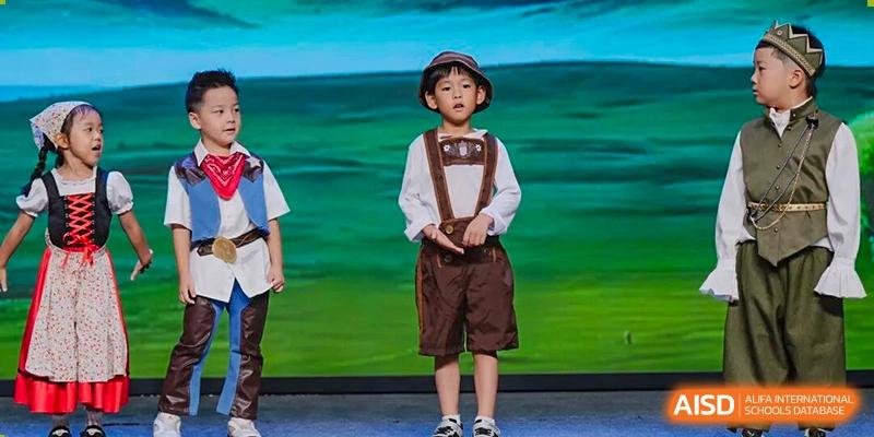 A young student in traditional European-style clothing standing on a stage during a cultural event or performance held at Concordia International School Ningbo.