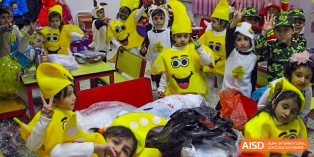 Young students from Pakistan Embassy College Beijing dressed in fun yellow costumes for a school event or performance.