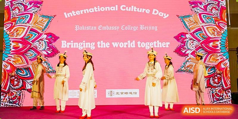 A student from Pakistan Embassy College Beijing performing a solo dance in a white dress at 'International Culture Day'.