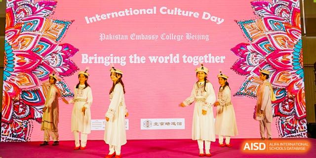 A student from Pakistan Embassy College Beijing performing a solo dance in a white dress at 'International Culture Day'.