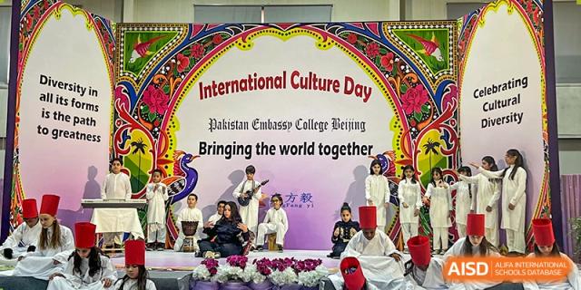 Students from Pakistan Embassy College Beijing performing music and cultural acts on stage during the 'International Culture Day' event.