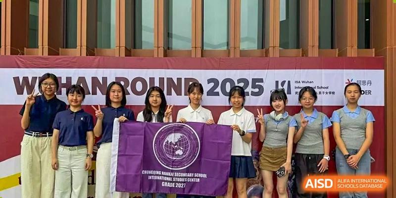 Four students stand behind a purple flag during a formal school event held outdoors at International Studies Center Of Chongqing Nankai Secondary School.
