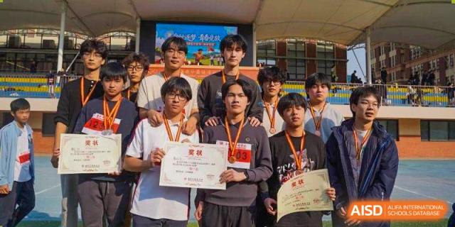 A group of male students proudly display their certificates and sports medals at Wuxi Foreign Language School International Curriculum Center.