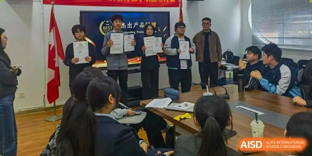 A large group of students gathers in a meeting room for a presentation and awards ceremony at XuZhou No.3 Middle School.