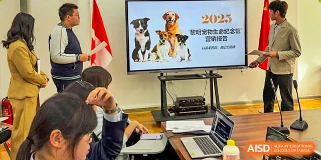 A monitor displays a 2023 presentation about animals during a classroom session for interested students at XuZhou No.3 Middle School.