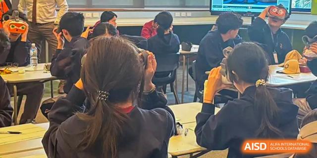 A student's perspective of a classroom setting during a collaborative group project or discussion at Guangzhou ULink International School.