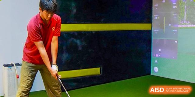 A detailed view of indoor training equipment and green turf walls in the school’s athletic facility at Guangzhou ULink International School.