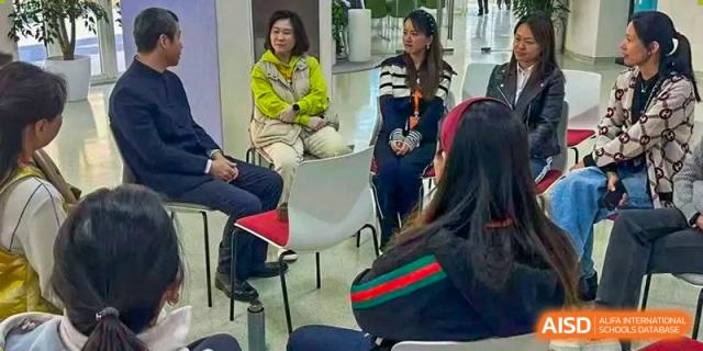 Teachers gather in a comfortable common area to discuss educational strategies during a team-building and planning session at Beanstalk International Bilingual School Shunyi Campus.