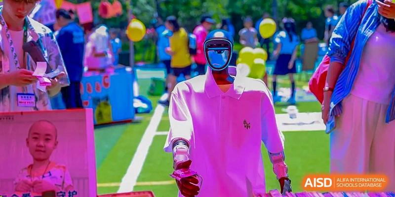 A humanoid robot stands outdoors during a technology and science fair event hosted for students at Beijing World Youth Academy.