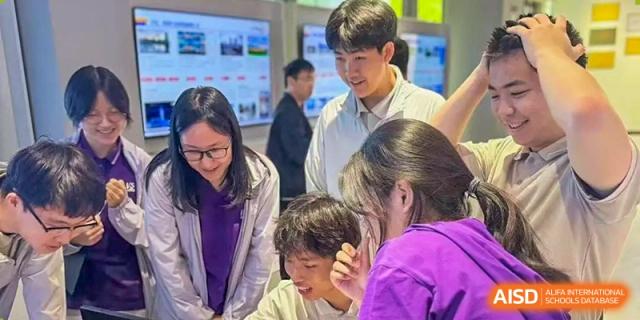 Two students focus on a collaborative academic task during a classroom activity at Beijing No. 35 High School International Department.