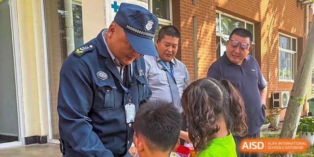 A local police officer visits the school to interact with students and staff during a safety day at TEDA International School Tianjin.