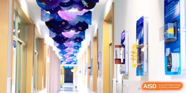 A brightly lit hallway decorated with colorful ceiling art, creating an inspiring and creative atmosphere for students walking between classes at Ronghaui International School.