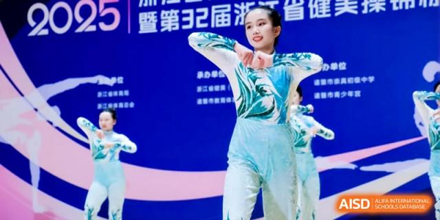 A gymnast performing a graceful routine on a competition stage, showcasing flexibility and talent in a sports competition at Ronghaui International School.