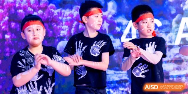 A close-up of a student performer during a theatrical stage production at Shanghai United International School, Shangyin Campus.