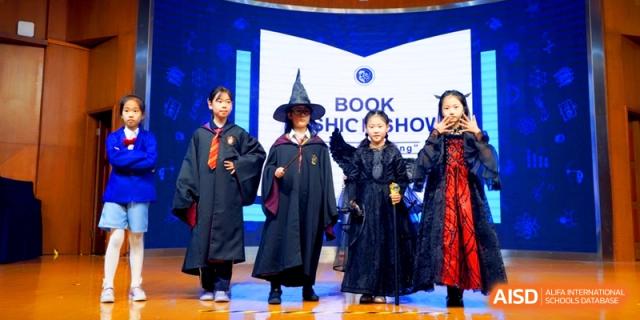 Students in wizard and gothic costumes on stage for a Book Fashion Show at Shanghai United International School, Shangyin Campus.