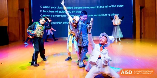 Children in various imaginative costumes strike poses during a stage play at Shanghai United International School, Shangyin Campus.