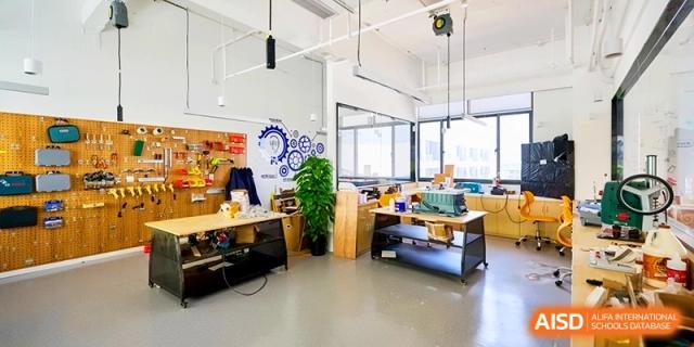 A modern school workshop with tools and equipment in a bright classroom at Shanghai United International School,Qingpu Campus