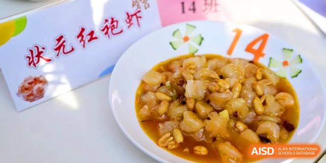 A bowl of sweet and sour pork or chicken nuggets served in a thick, glossy sauce at Kunshan Senior High School.