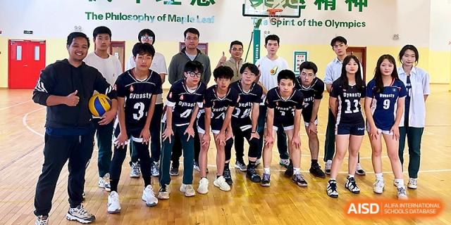 A boys' basketball team posing together on the hardwood court at Maple Leaf International School - Xi_an.