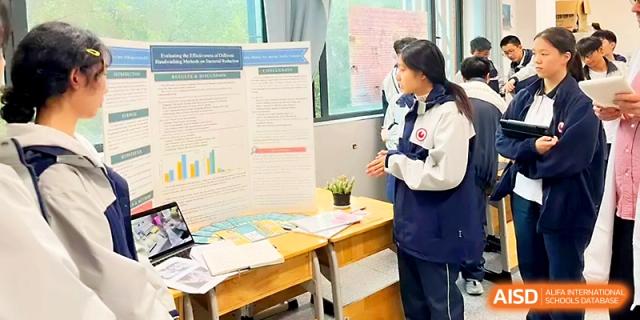 A student presents a detailed science fair project using a tri-fold board and data charts in a classroom at Wuhan No.2 High School.