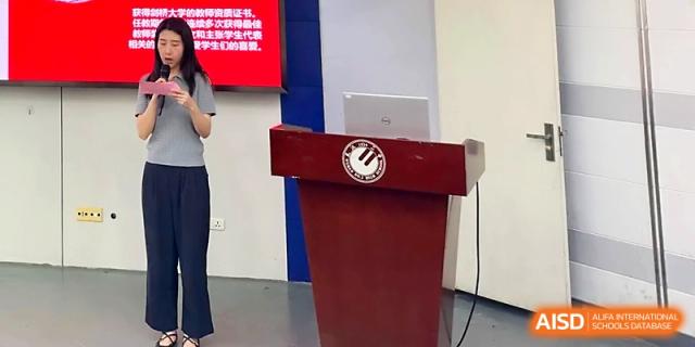 A close-up of a wooden podium on a stage prepared for a school presentation at Wuhan No.2 High School.