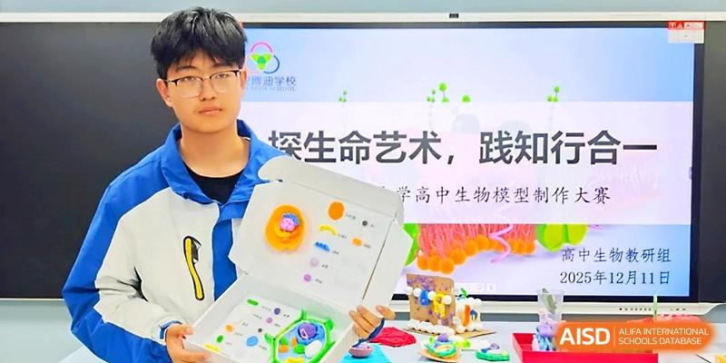 A student displays a detailed creative project about biology and science in a classroom setting at Xi_an Bodi School.