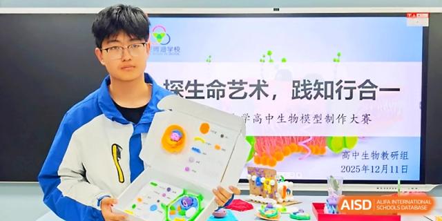 A student displays a detailed creative project about biology and science in a classroom setting at Xi_an Bodi School.