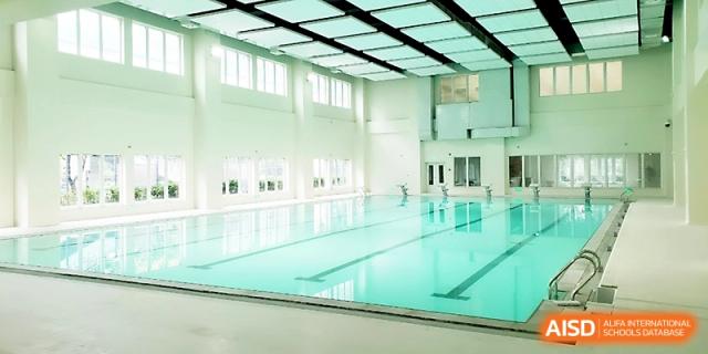 An indoor swimming pool facility with clear blue water and lanes for student recreation at Xi_an Hanova International School.