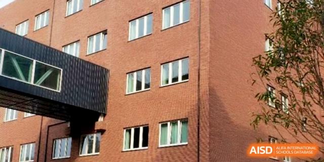 A close-up view of the modern brick architecture and window design of the campus buildings at Xi_an Hanova International School.