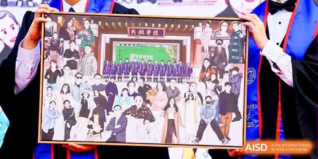 Students hold up a large, colorful illustration during a creative school event or graduation party at Beijing Xicheng Academy.