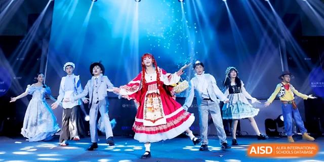 A lead performer in a red and white dress sings center stage during a vibrant musical theater event at Yangjiang Yangdong Eone school.
