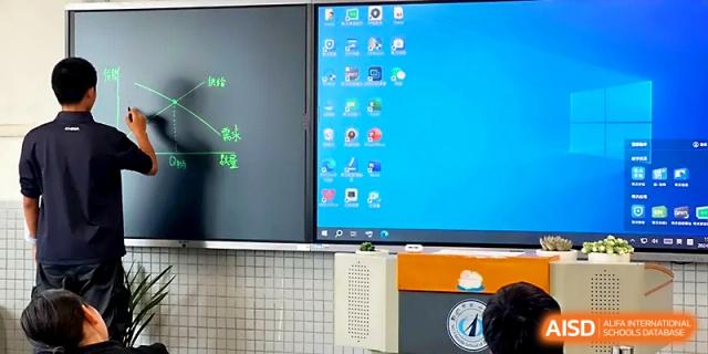 A large digital screen displays educational software and icons for a modern interactive learning experience at Zhengzhou No.1 High School