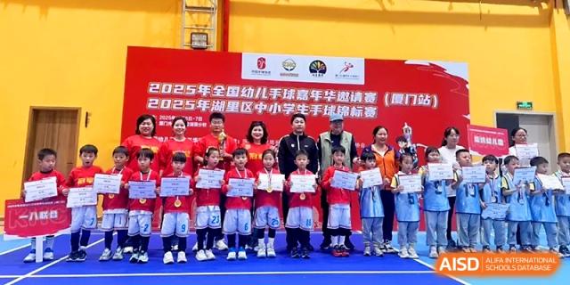 A group of students proudly displays their award certificates after a successful sports event at Zhengzhou No.1&8 United International School