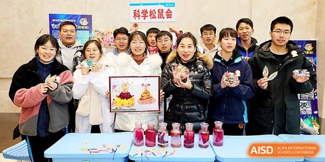 Students and teachers proudly display colorful science projects and bottled specimens in a classroom at Zhengzhou No.4 Middle School