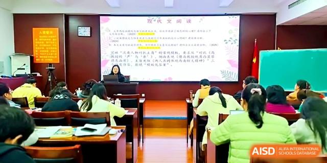 Teachers attending a professional seminar in a modern multimedia room at Zhengzhou No.4 Middle School.