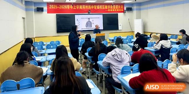 A teacher presenting a lesson using a large interactive digital board at Zhengzhou No.4 Middle School.